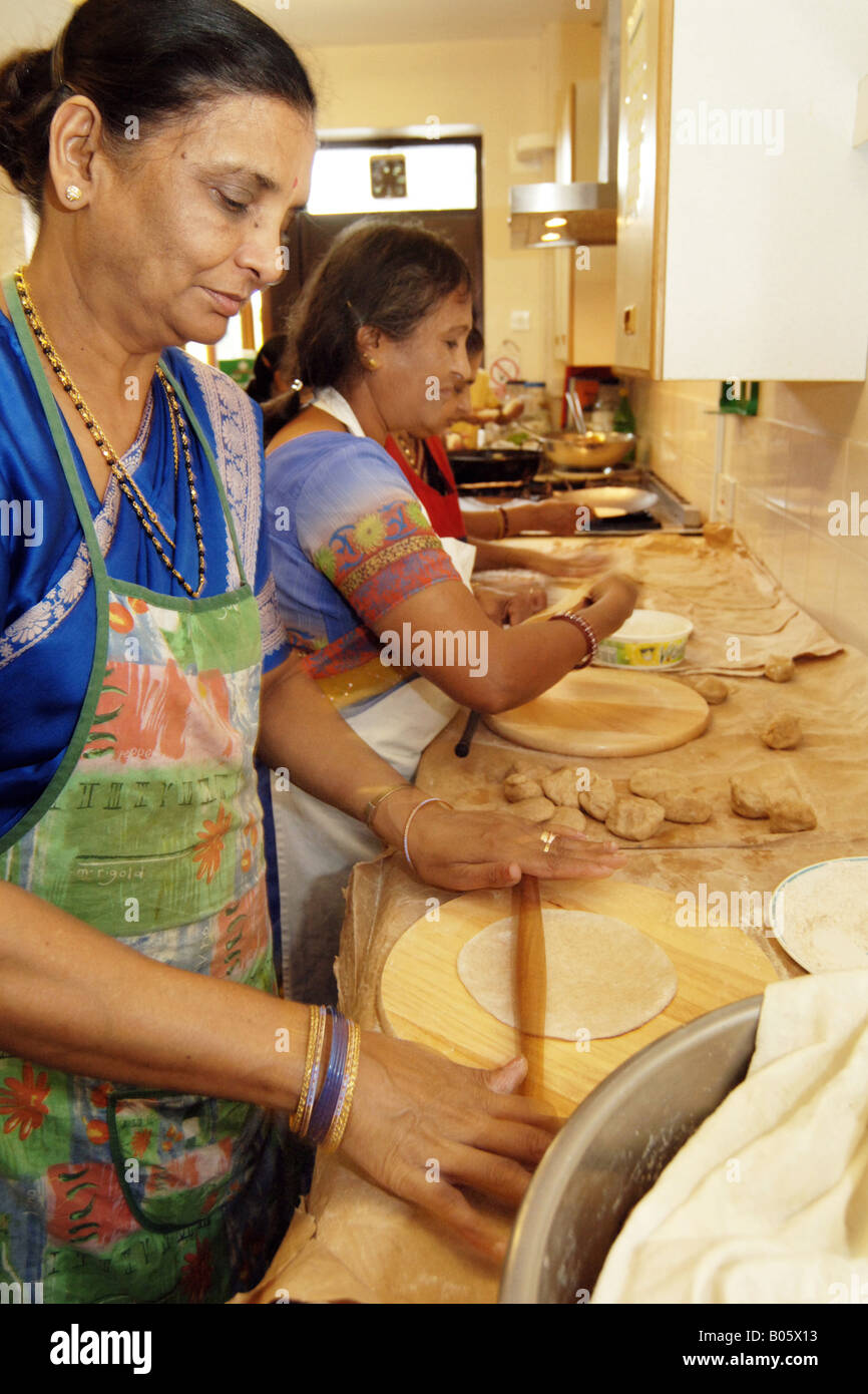 Gujerati women cook lunch for a community event Bradford Stock Photo