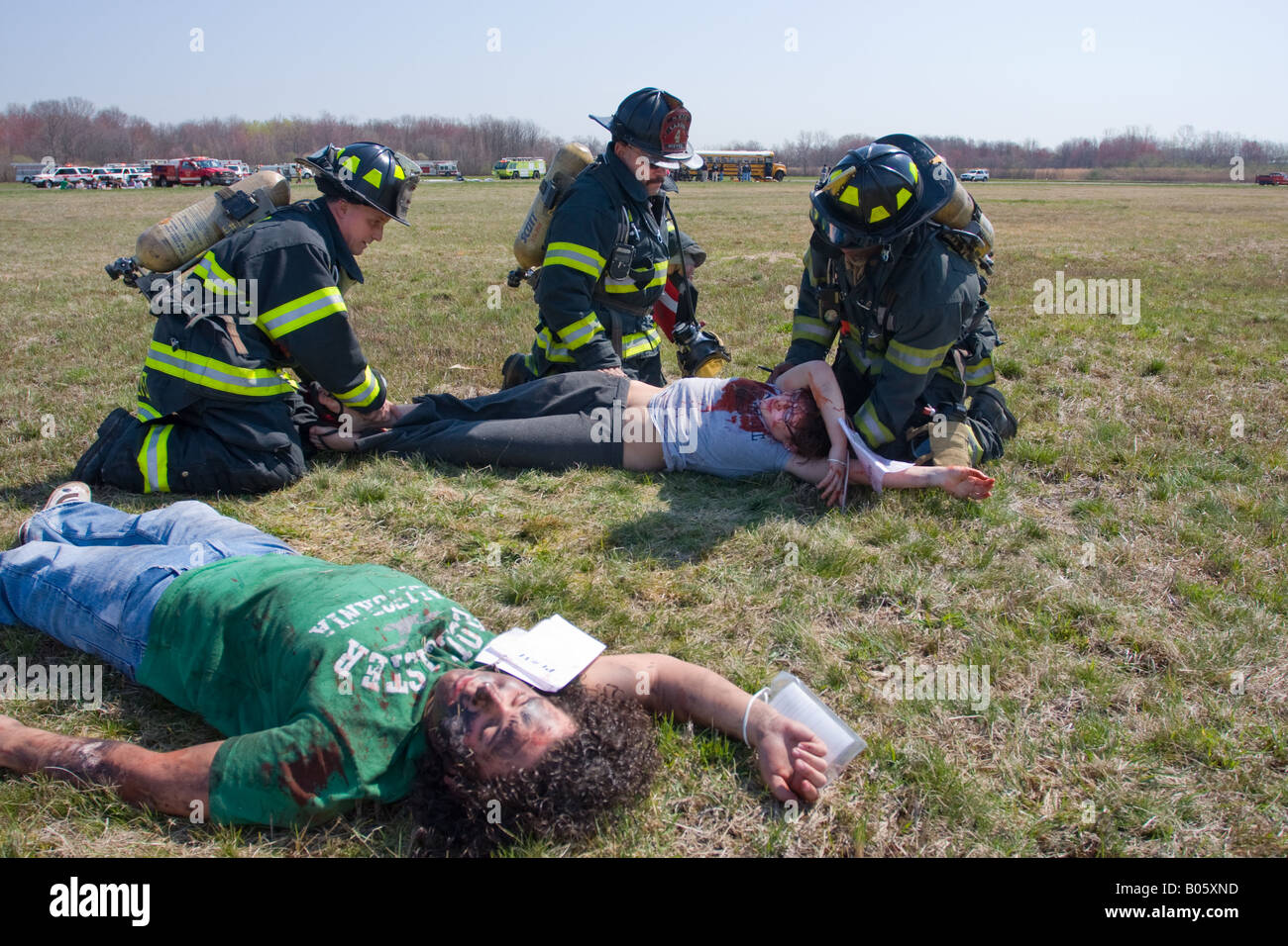Firefighters from the New Haven Fire department tend to 'Injured' during a mock plane crash drill at Tweed New Haven Airport. Stock Photo