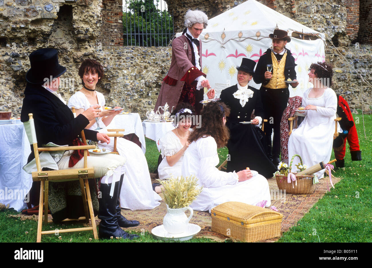 Regency Period Historical Re-enactment 1815 gentry servant tent hamper wine costume ladies dresses white English history England Stock Photo
