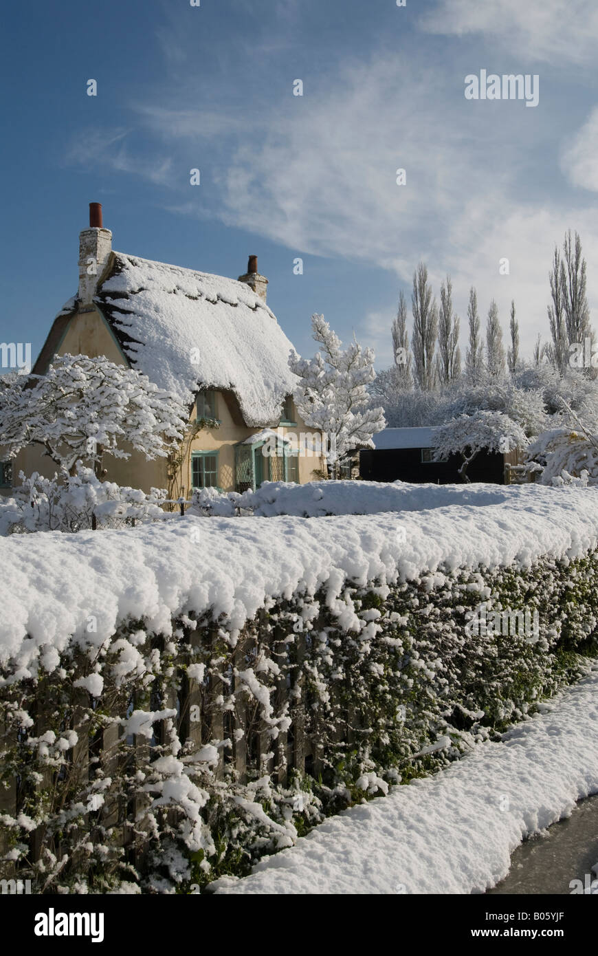 Thatched Cottage Snow Stock Photos & Thatched Cottage Snow Stock Images
