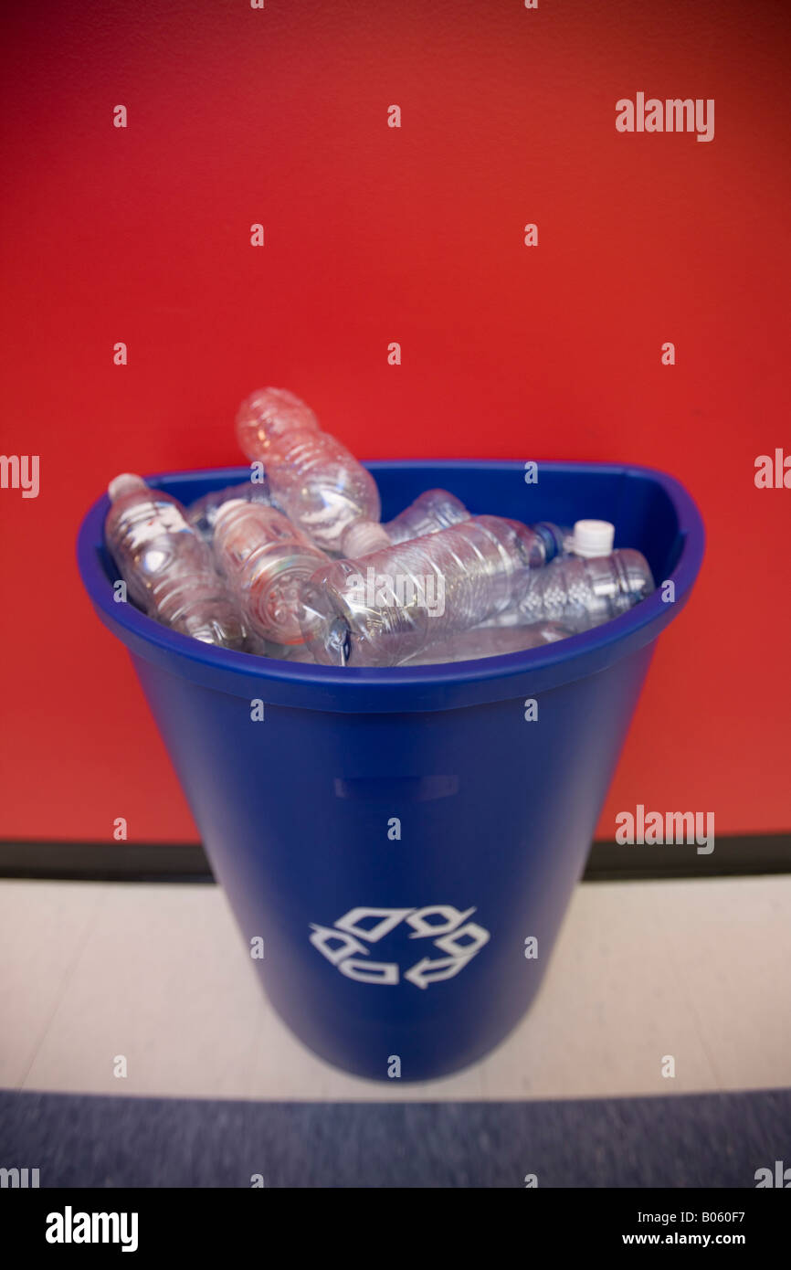 Recycling container with plastic bottles at business office Stock Photo