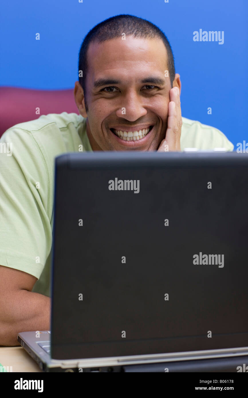 Happy businessman with portable computer Stock Photo