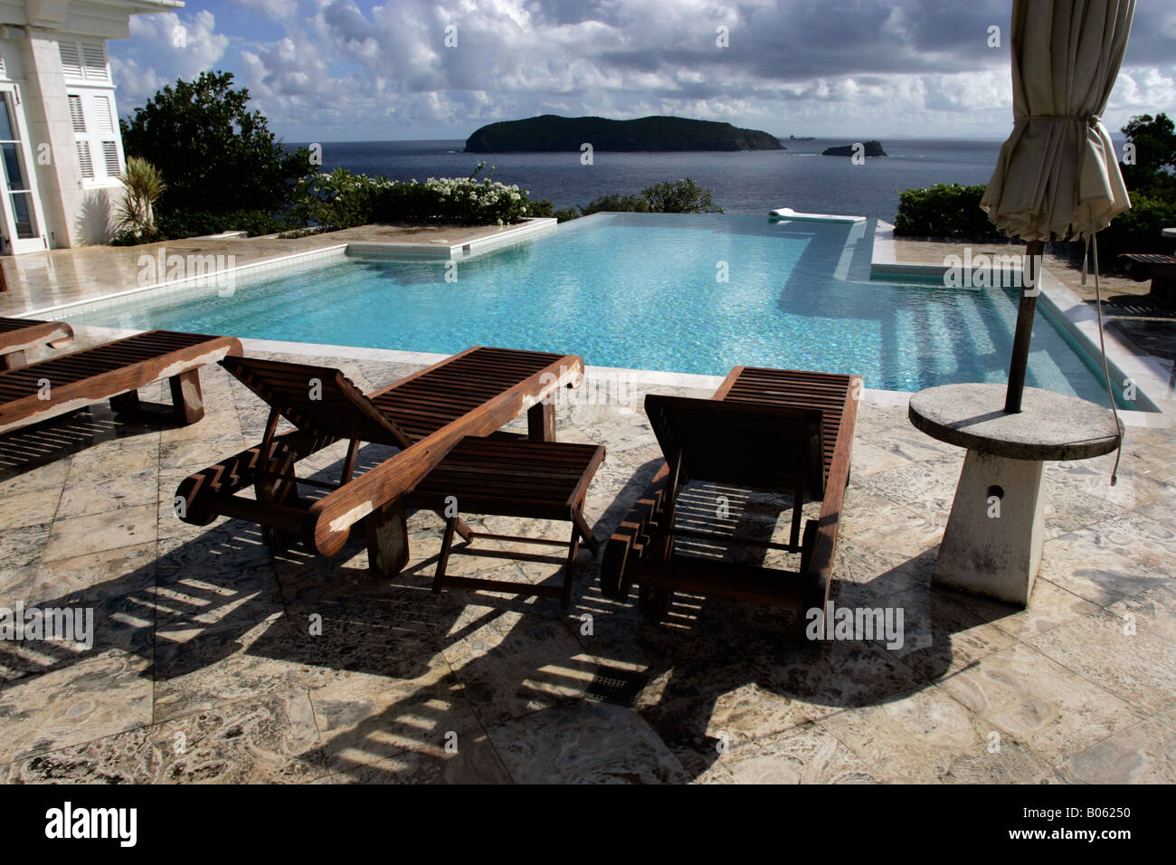 The infinity pool at Princess Margaret's former villa Les Jolies Eaux, Mustique, St. Vincent and the Grenadines. Stock Photo