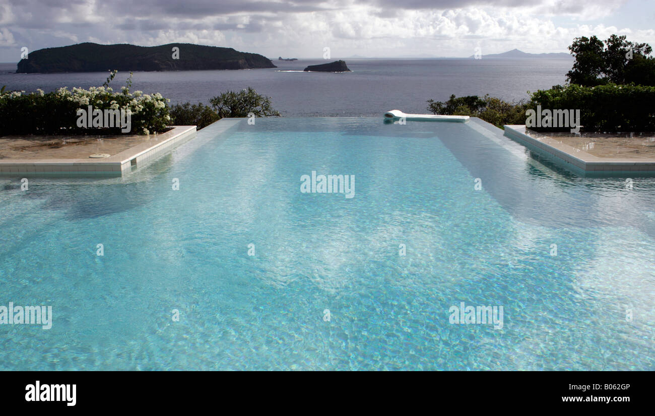 The infinity pool at Princess Margaret's former villa Les Jolies Eaux, Mustique, St. Vincent and the Grenadines. Stock Photo
