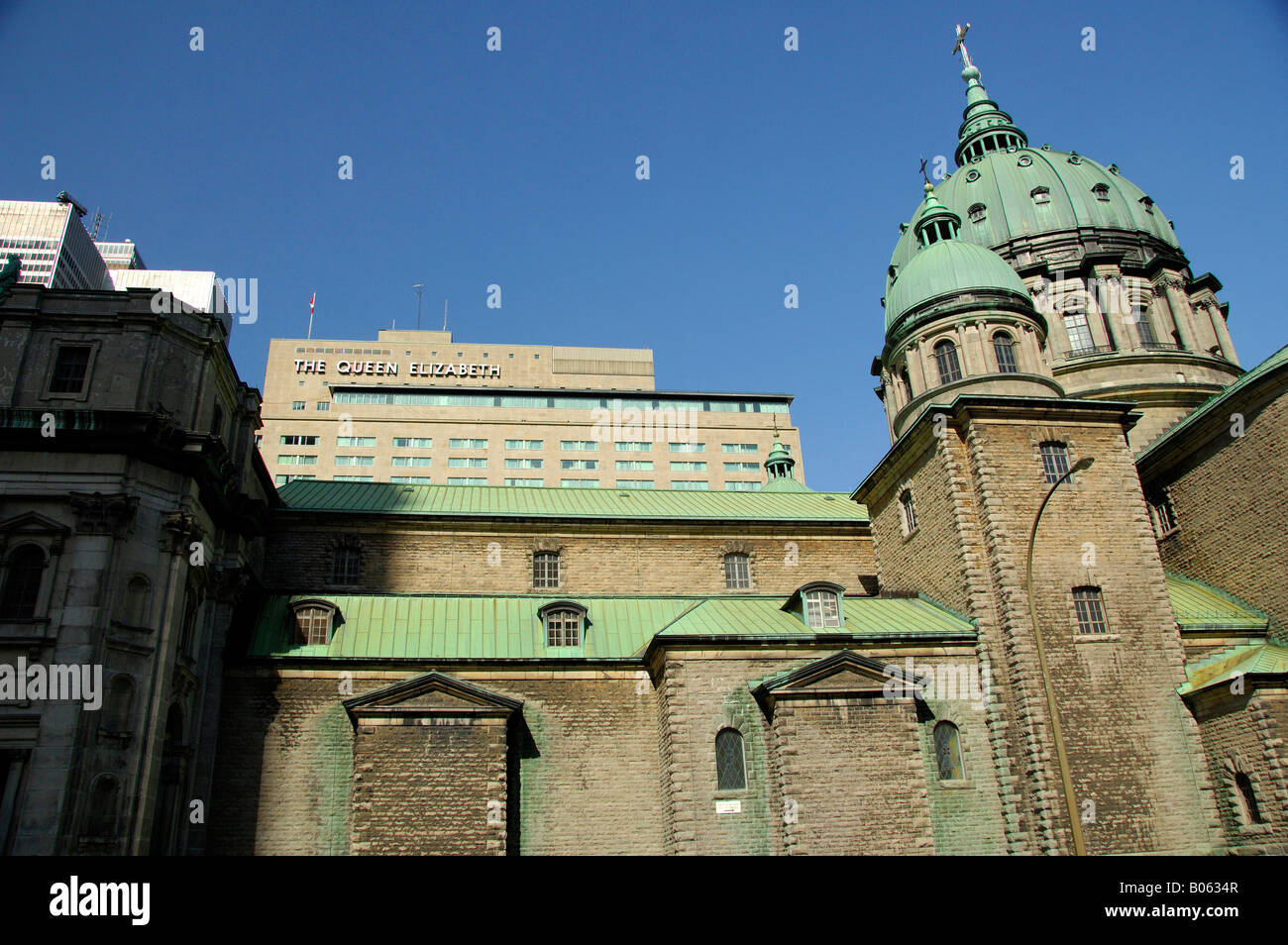 Canada, Quebec, Montreal. Mary Queen of the World Cathedral. The Queen Elizabeth hotel in distance. Stock Photo