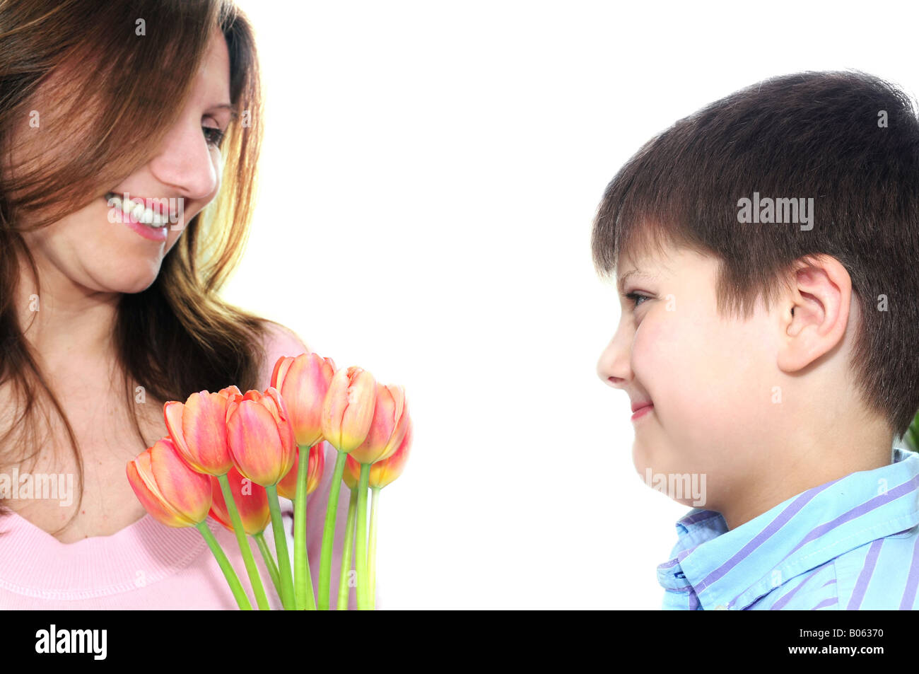 Mother receiving a bouquet of flowers from her son Stock Photo - Alamy