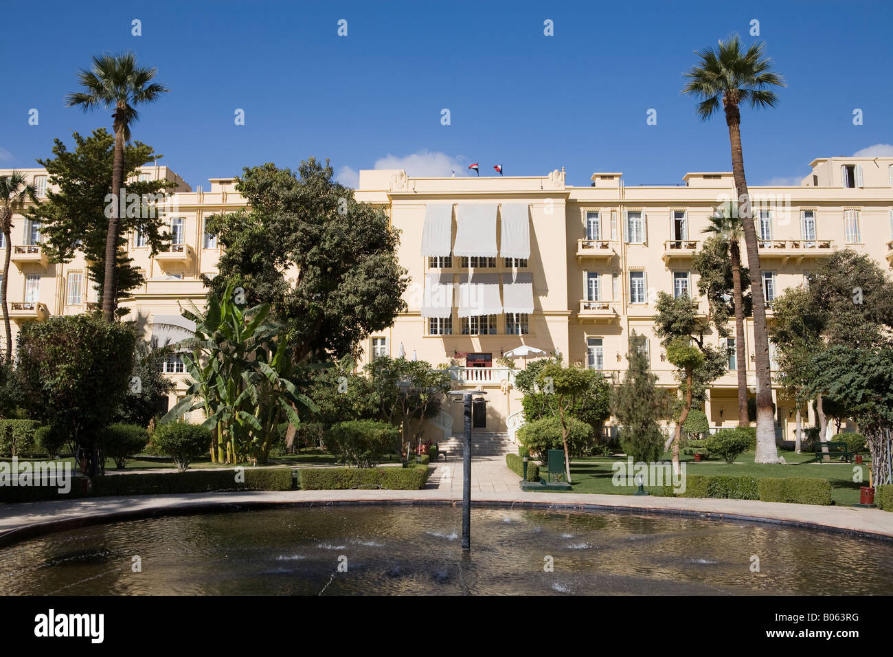The rear of the Old Winter Palace Hotel as seen from the gardens, Luxor Egypt Stock Photo