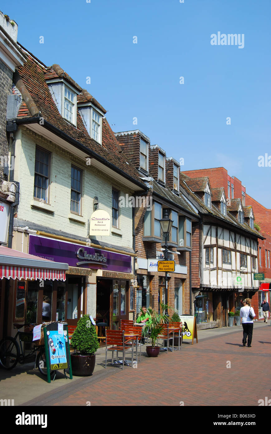 Pedestrianised street shops restaurants tourists hires stock