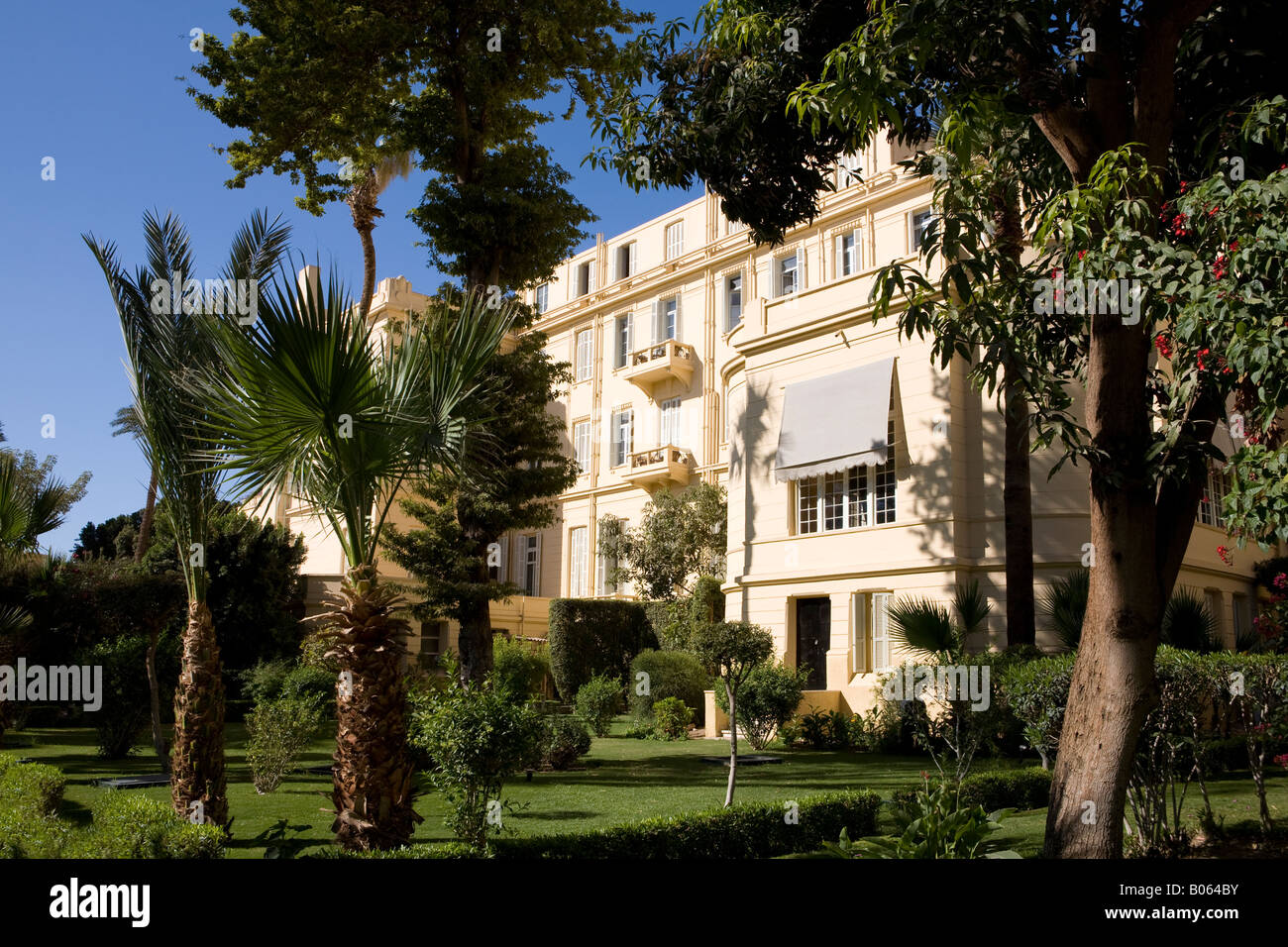 The back of The Old Winter Palace Hotel as seen from the gardens, Luxor Egypt Stock Photo