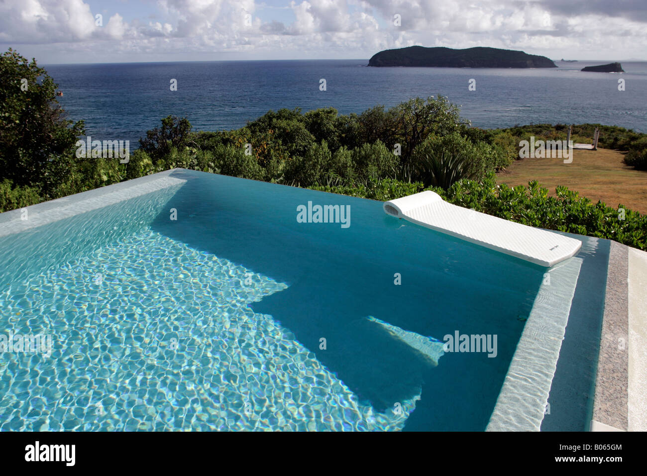The infinity pool at Princess Margaret's former villa, Les Jolies Eaux, on the island of Mustique. Stock Photo