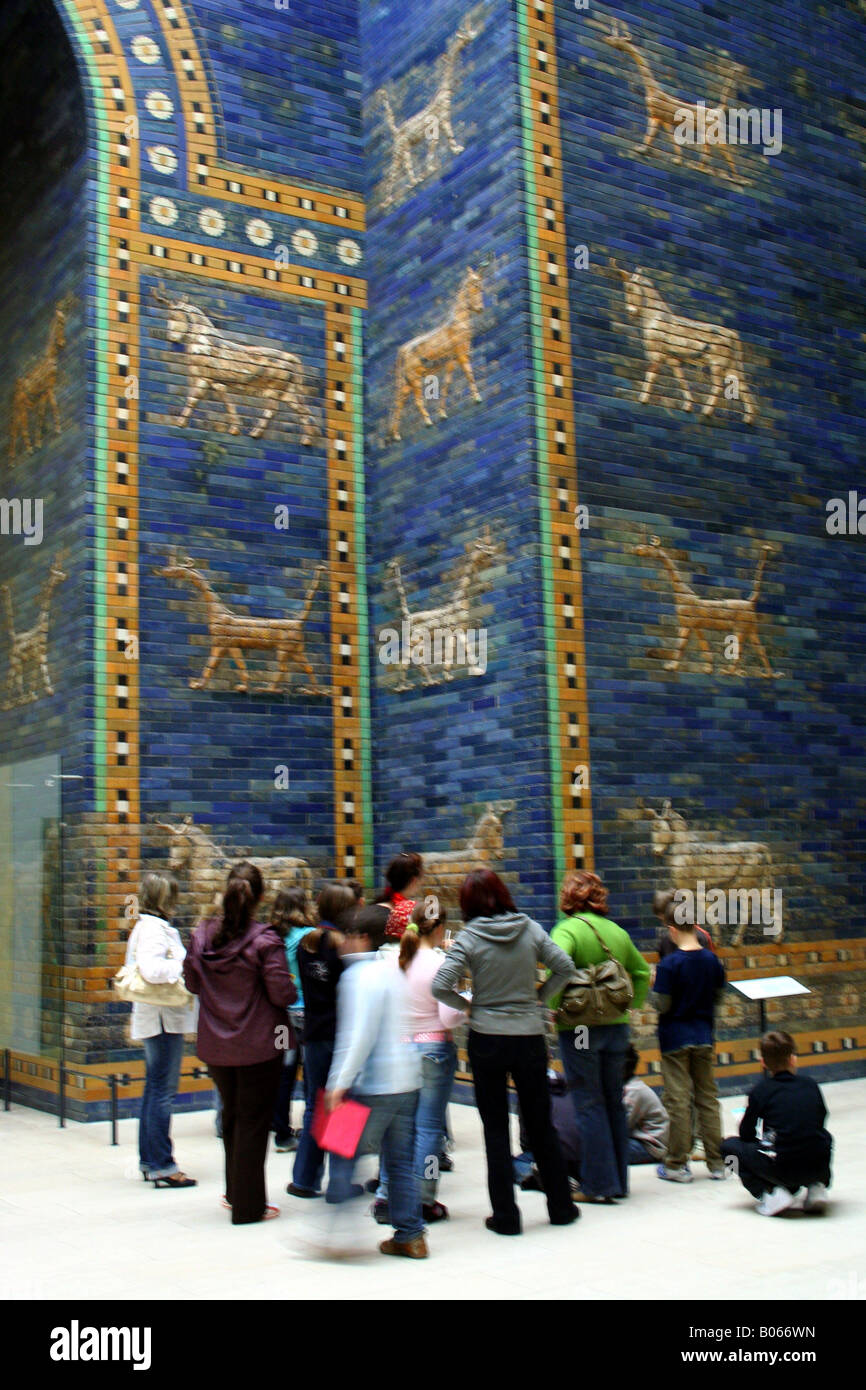 visitors admiring animals in ceramics on the reconstructed Ishtar gate (Babylon) in Pergamon museum, Berlin, Germany Stock Photo