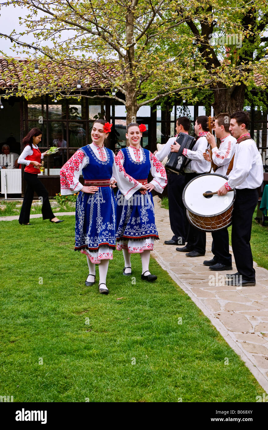 A stop for lunch at a folk style restaurant with live folklore entertainment in Arbanassi Bulgaria. Stock Photo