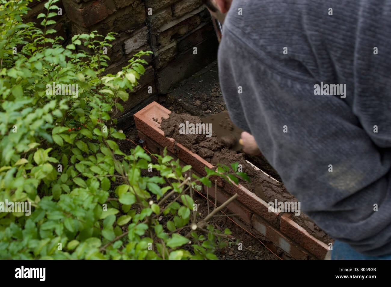 DIY How to build a brick wall Stock Photo Alamy