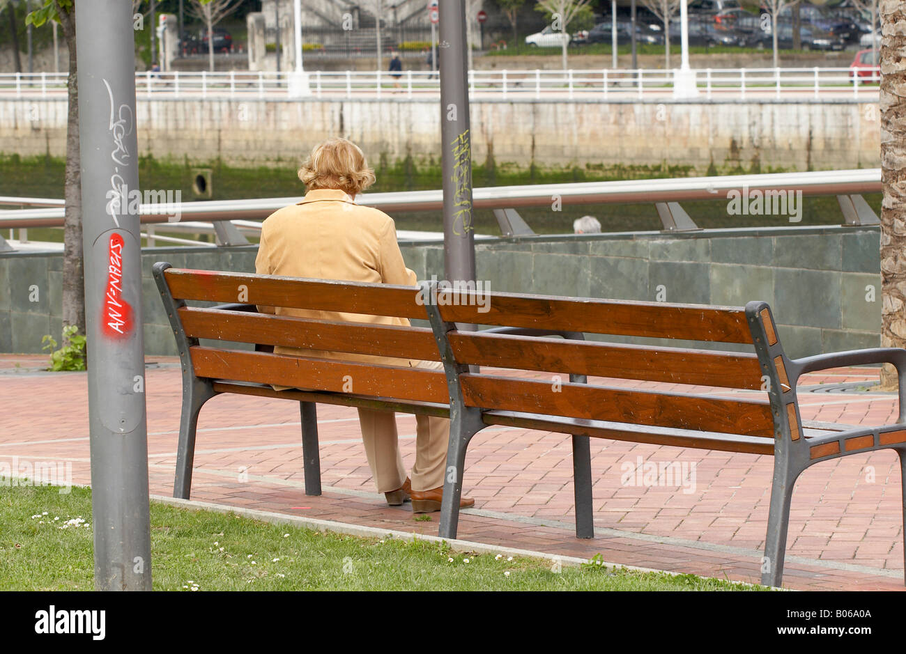A senior woman on a bench Stock Photo - Alamy