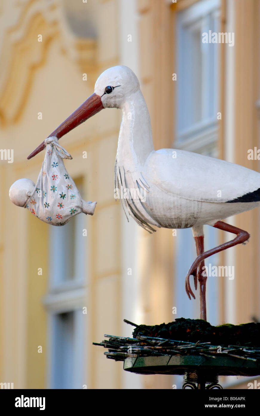 Europe, Germany, Bavaria, Bamberg, Store signage of Stork delivering baby child Stock Photo