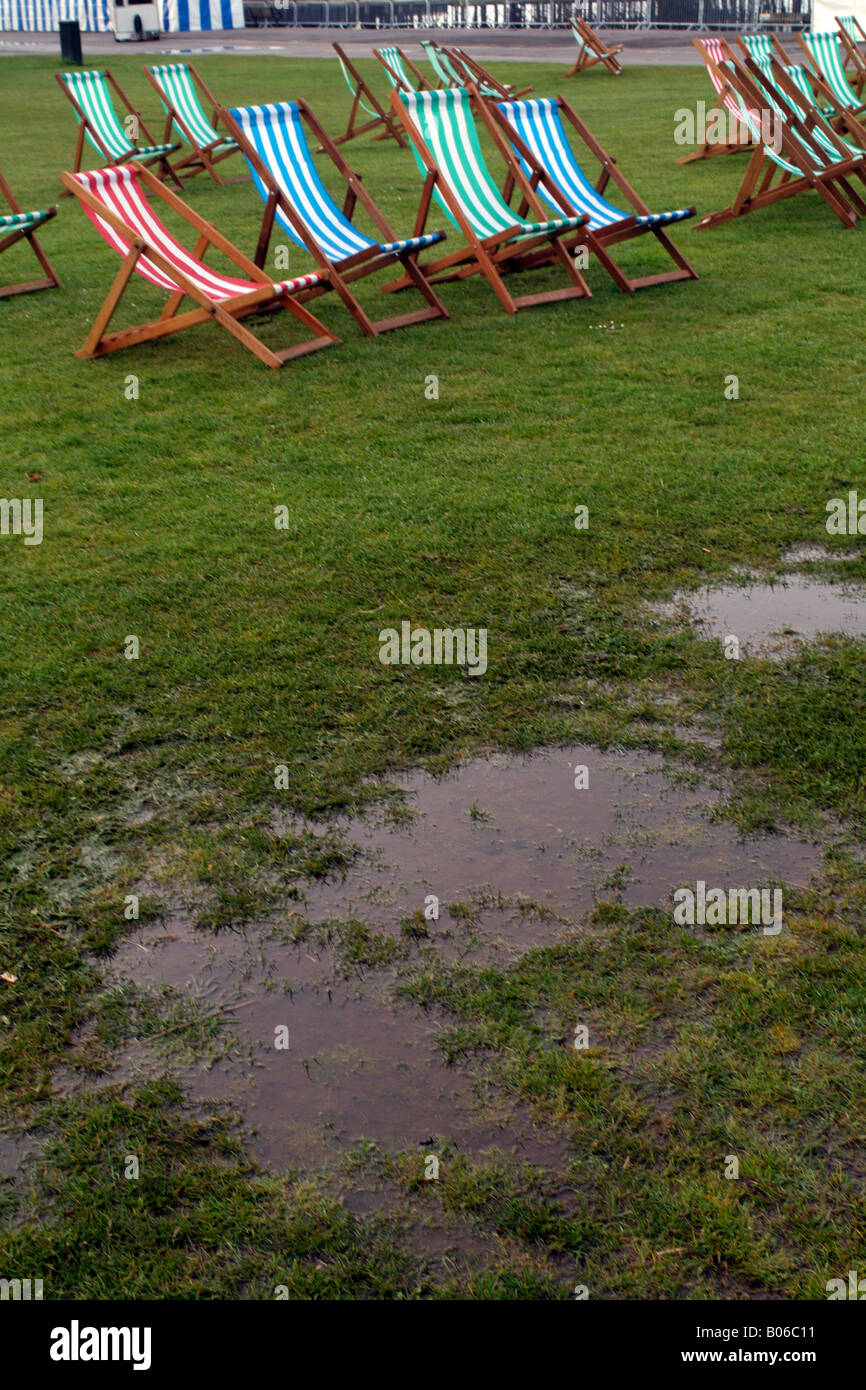 Typical British Summer Parkland Scene Wet Damp Deck Chairs and Puddles