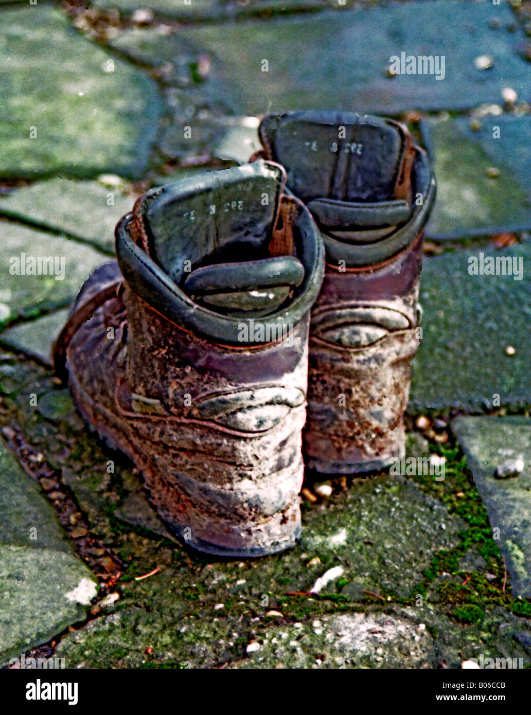 pair of hiking boots on rough pavement Stock Photo Alamy