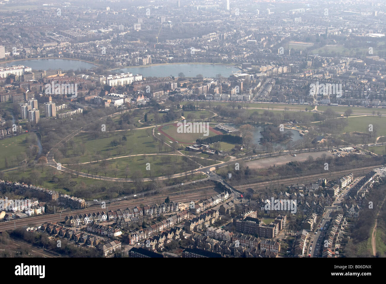 Aerial view south east of Finsbury Park East West Reservoir urban houses Haringey London N4 N16 England UK High level oblique Stock Photo