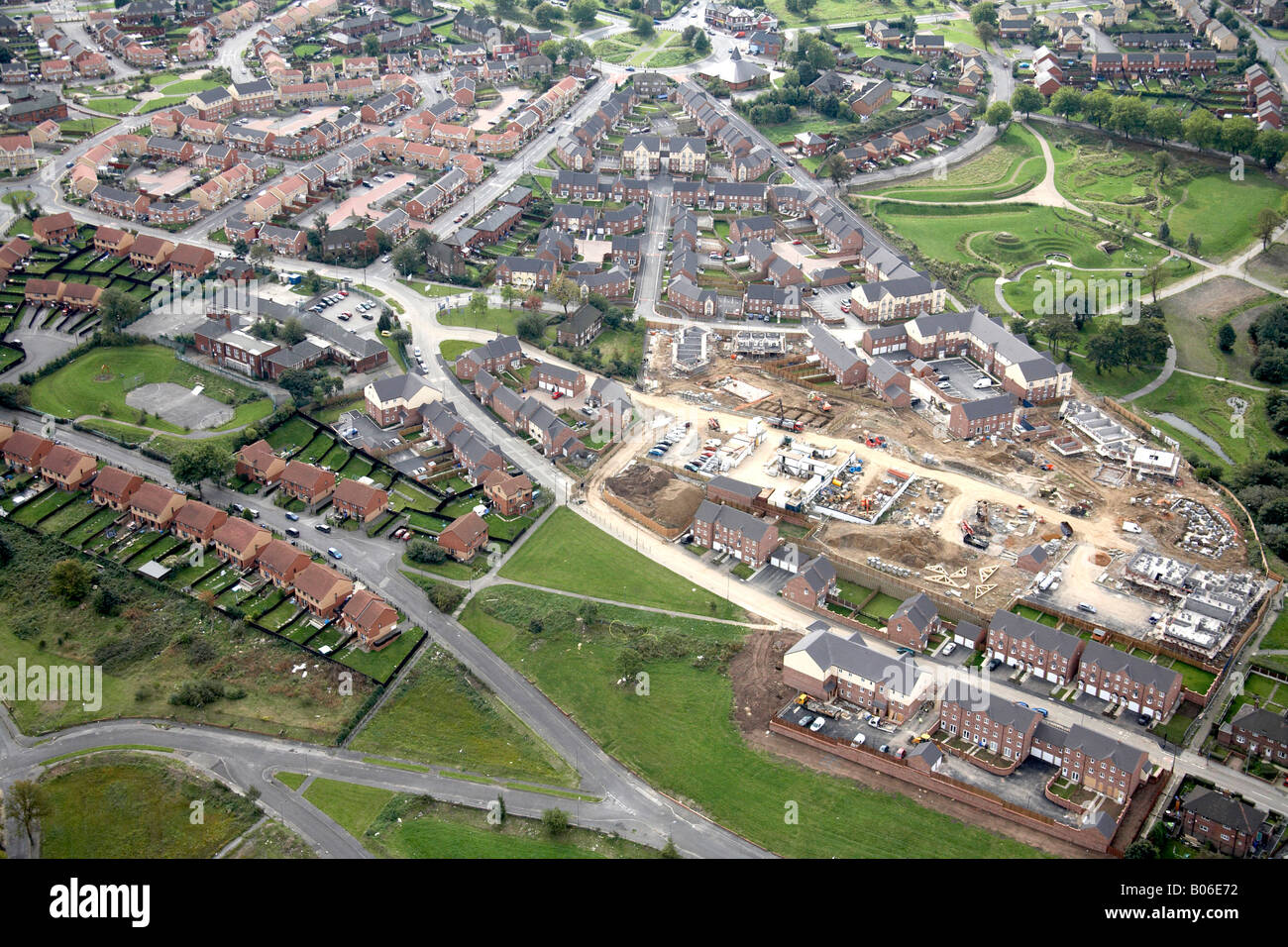Aerial view south west of suburban housing and construction work Queen