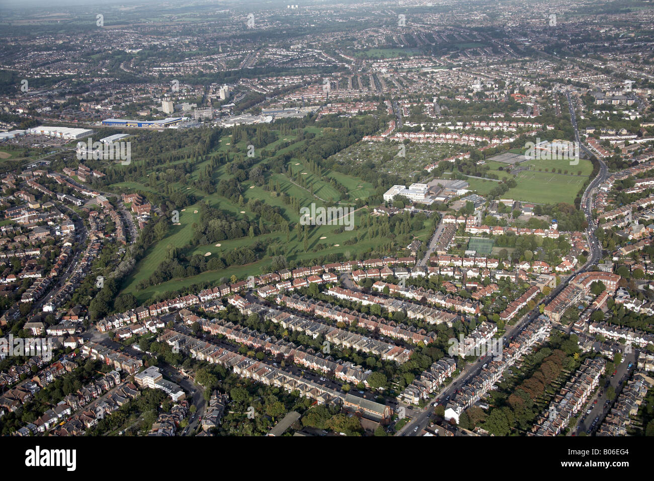 Aerial view north east of Muswell Hill Golf Course Recreation Ground Tennis Courts suburban houses Alexandra Park Rd London N10 Stock Photo