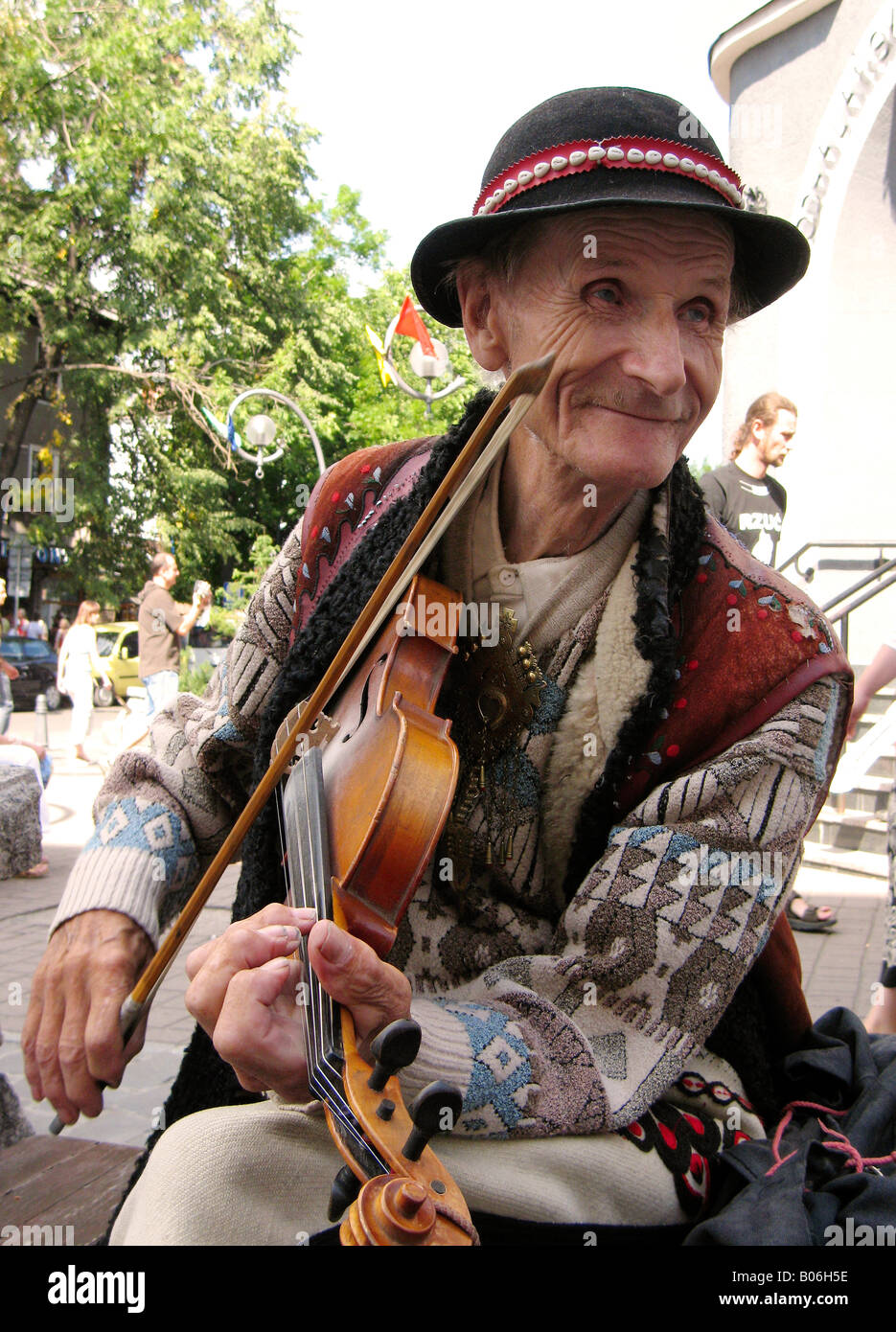 Poland Zakopane town Tatras Mt Krupowki Street Goral playing Stock Photo