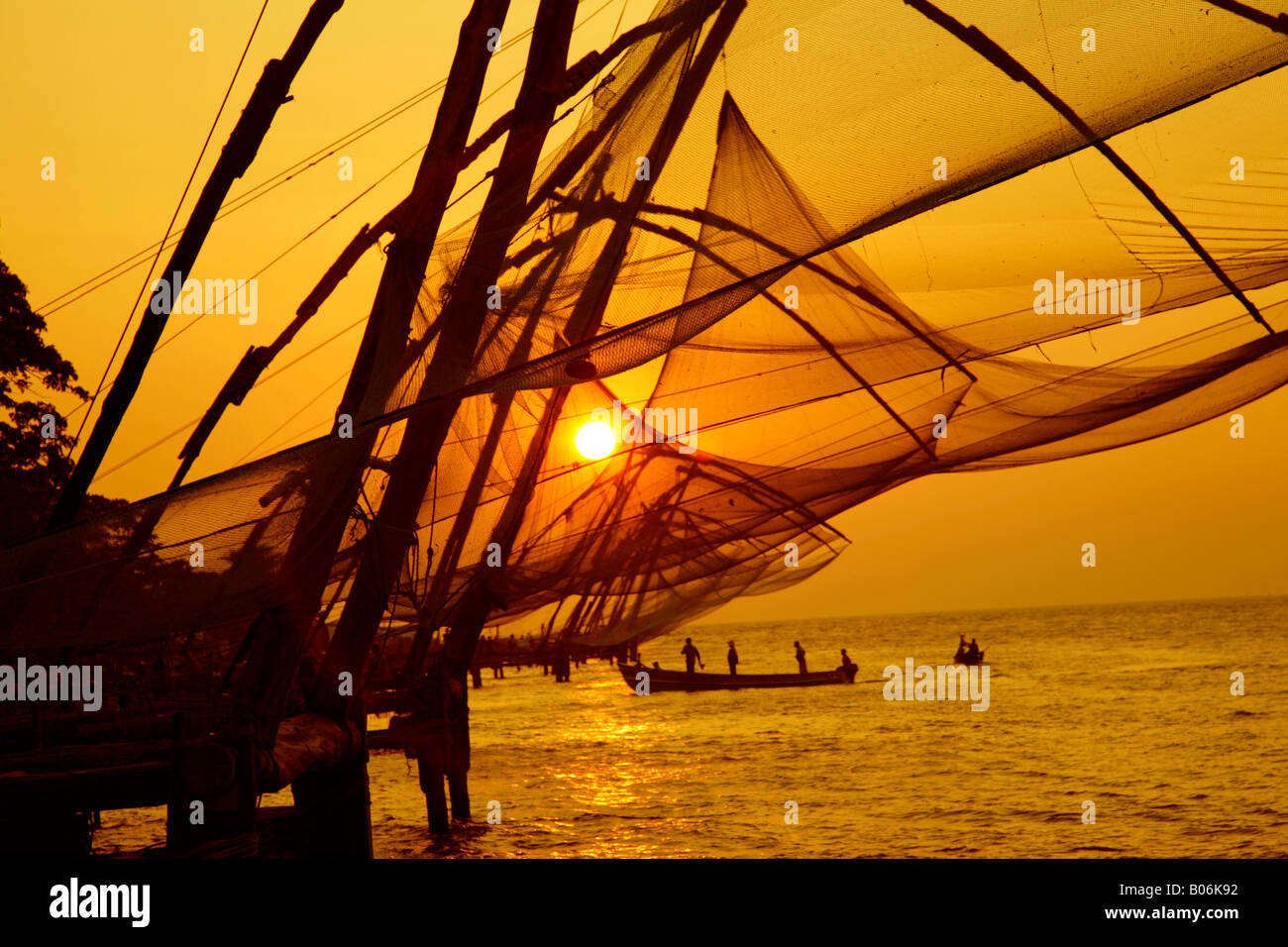 Chinese net at fort kochi,india during sunset time Stock Photo - Alamy