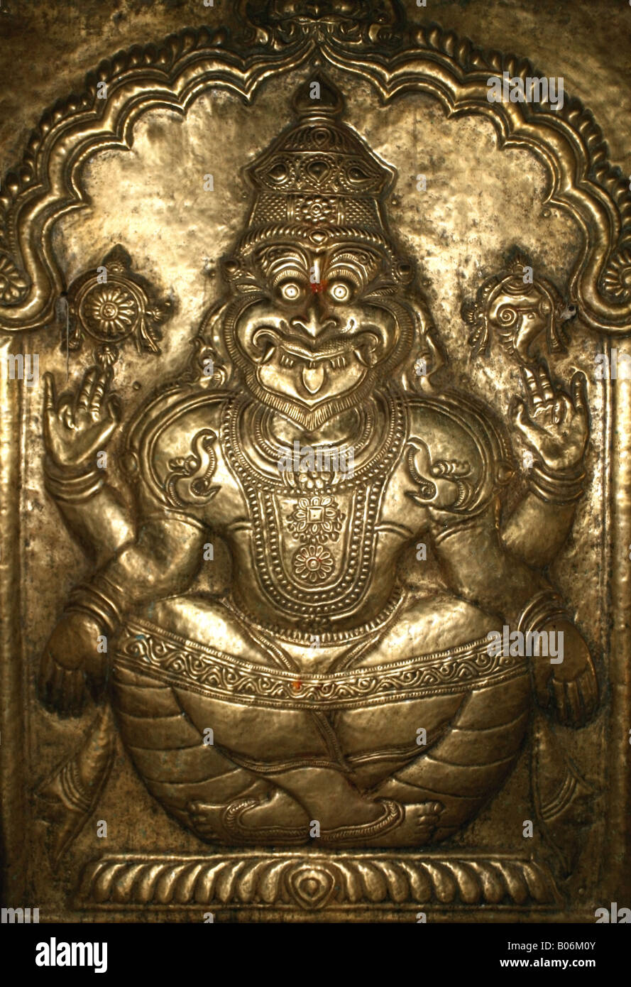 Bronze bas relief on a temple door of Narasimha an avatar of the Hindu god Vishnu , India Stock Photo