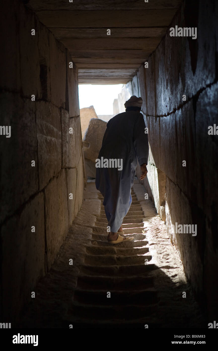 Climbing pylon steps at the Ramesseum, Mortuary Temple of Ramesses II on West Bank of the Nile at Luxor, Egypt, North Africa Stock Photo