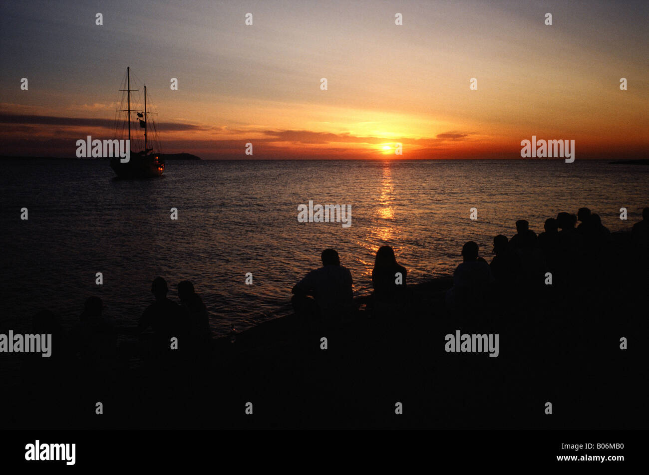 people watching the Sunset from Cafe Del Mar Sant Antonio del Portmany Ibiza Balearic islands Spain Stock Photo