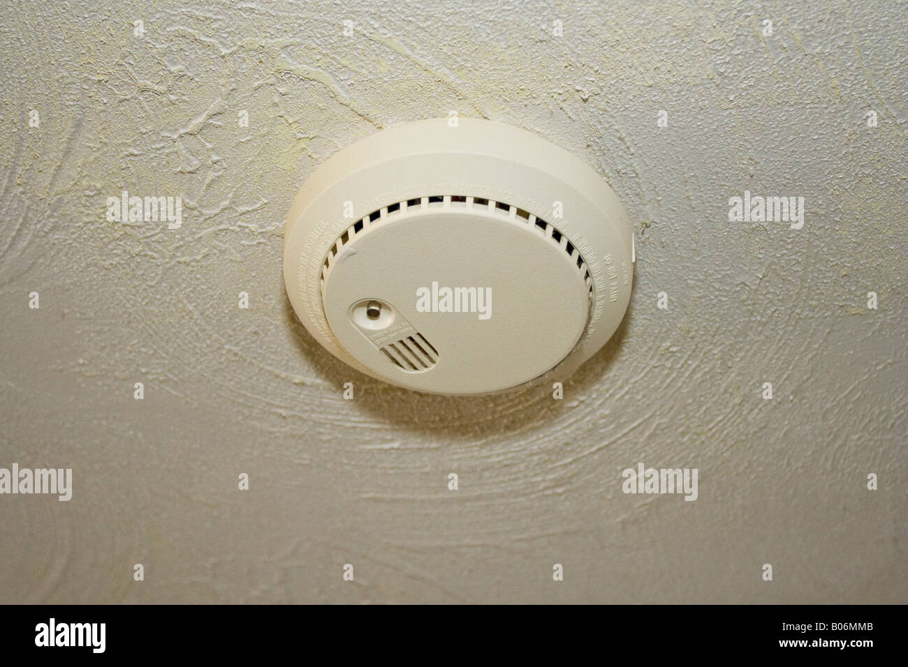 Battery Operated Fire Detector Mounted To The Ceiling Stock