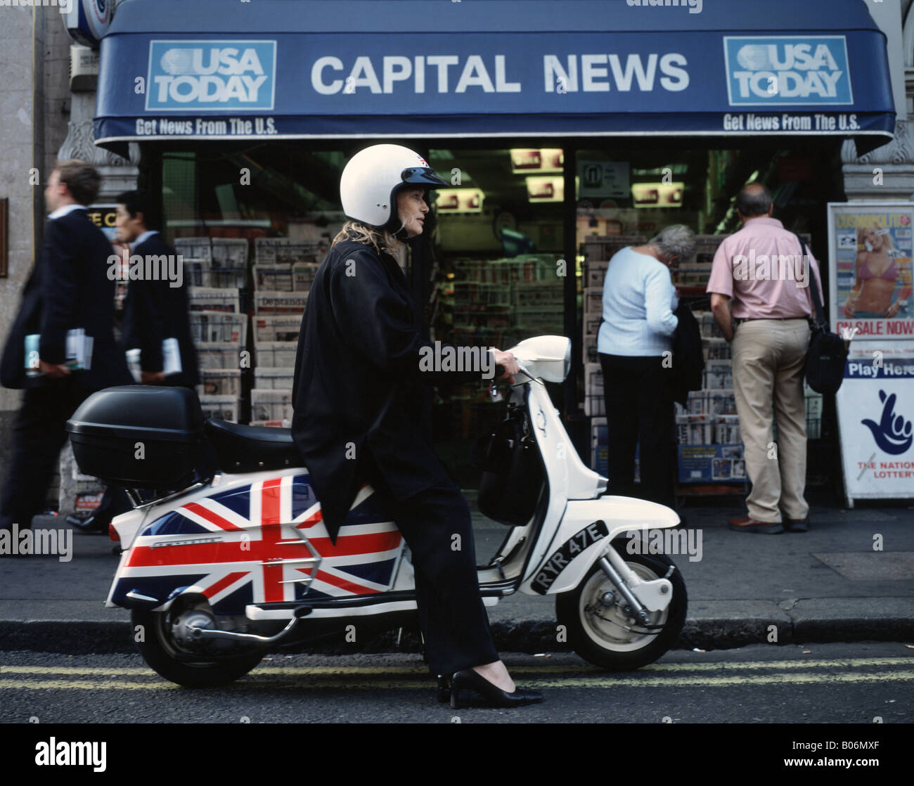 Woman riding a Lambretta Soho London England Britain UK Stock Photo - Alamy