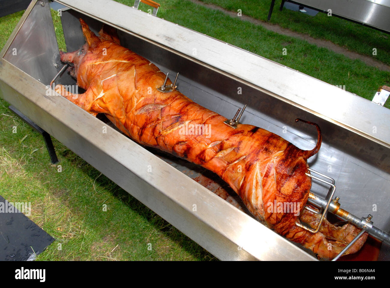 Taste of London Show , whole pig roasting on spit Stock Photo Alamy