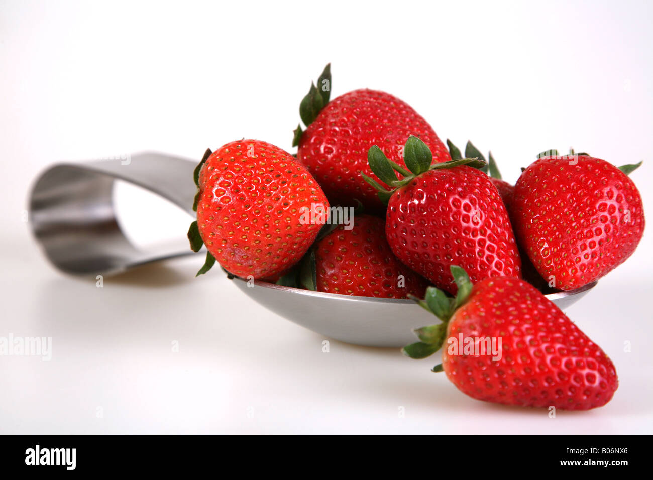 Strawberrys in a spoon Stock Photo - Alamy