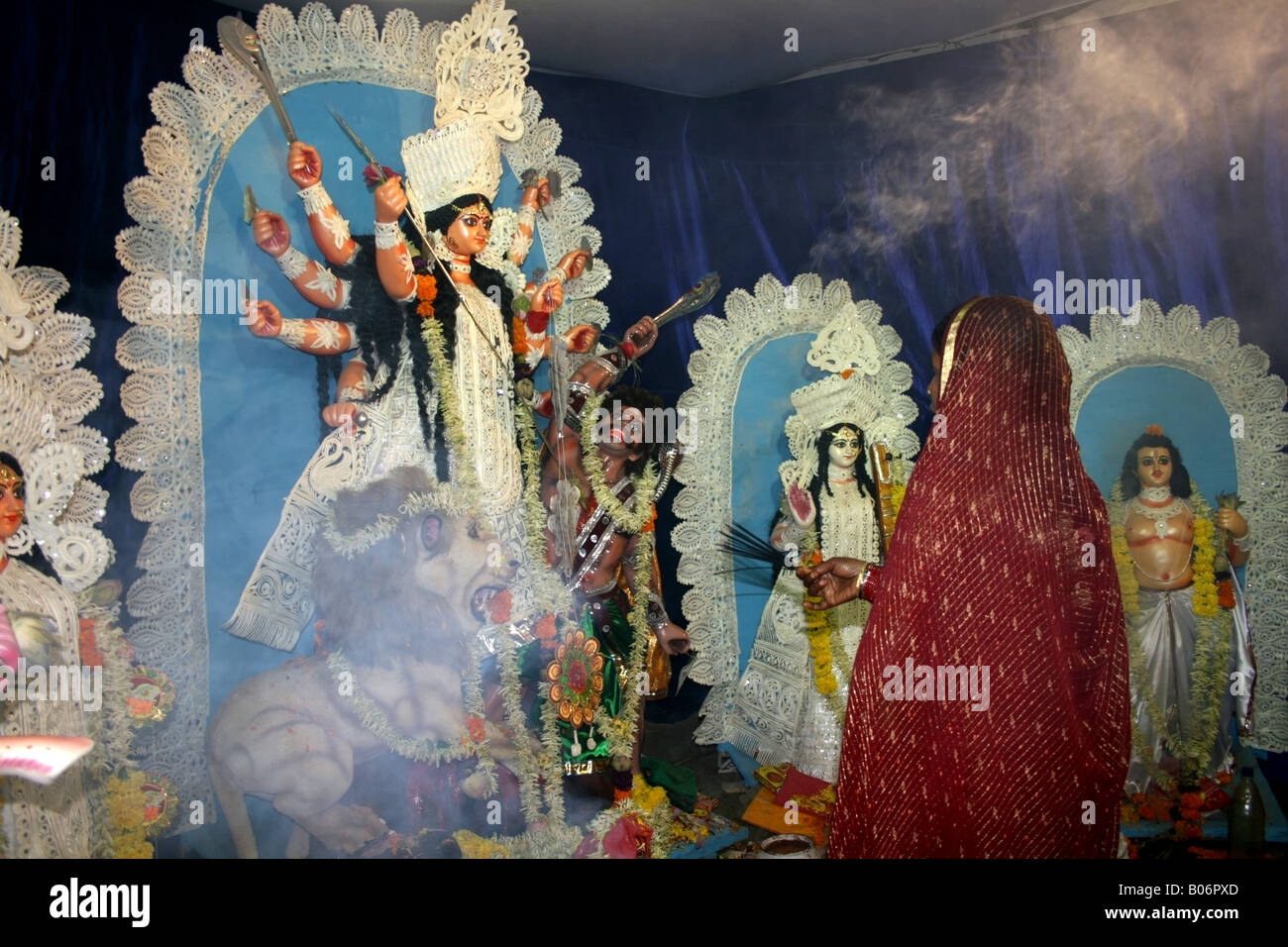 Lady Hindu Worshipper Praying At A Durga Shrine, Dassara Festival 