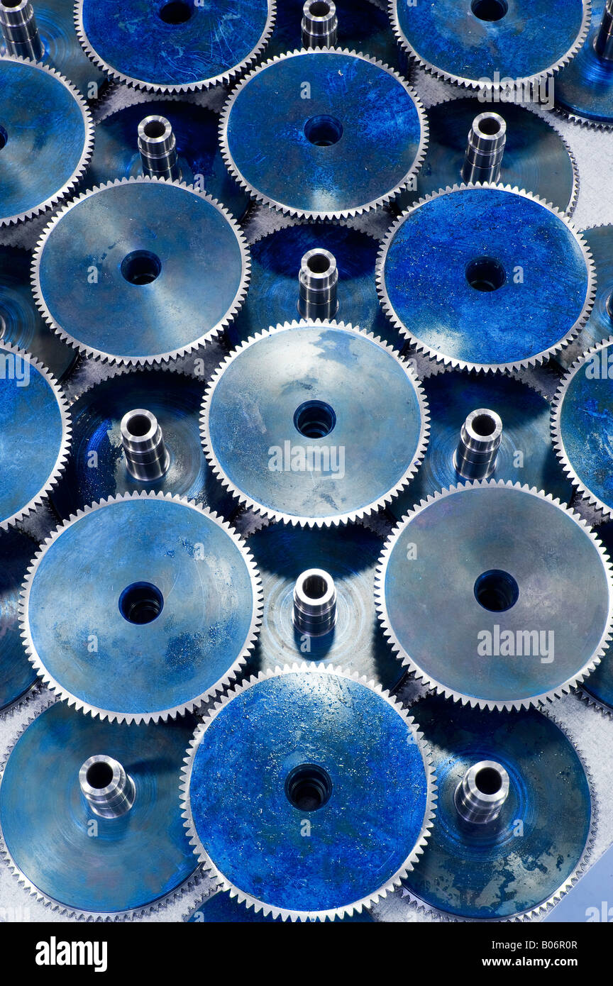 Generic blue circular gears form a pattern Stock Photo