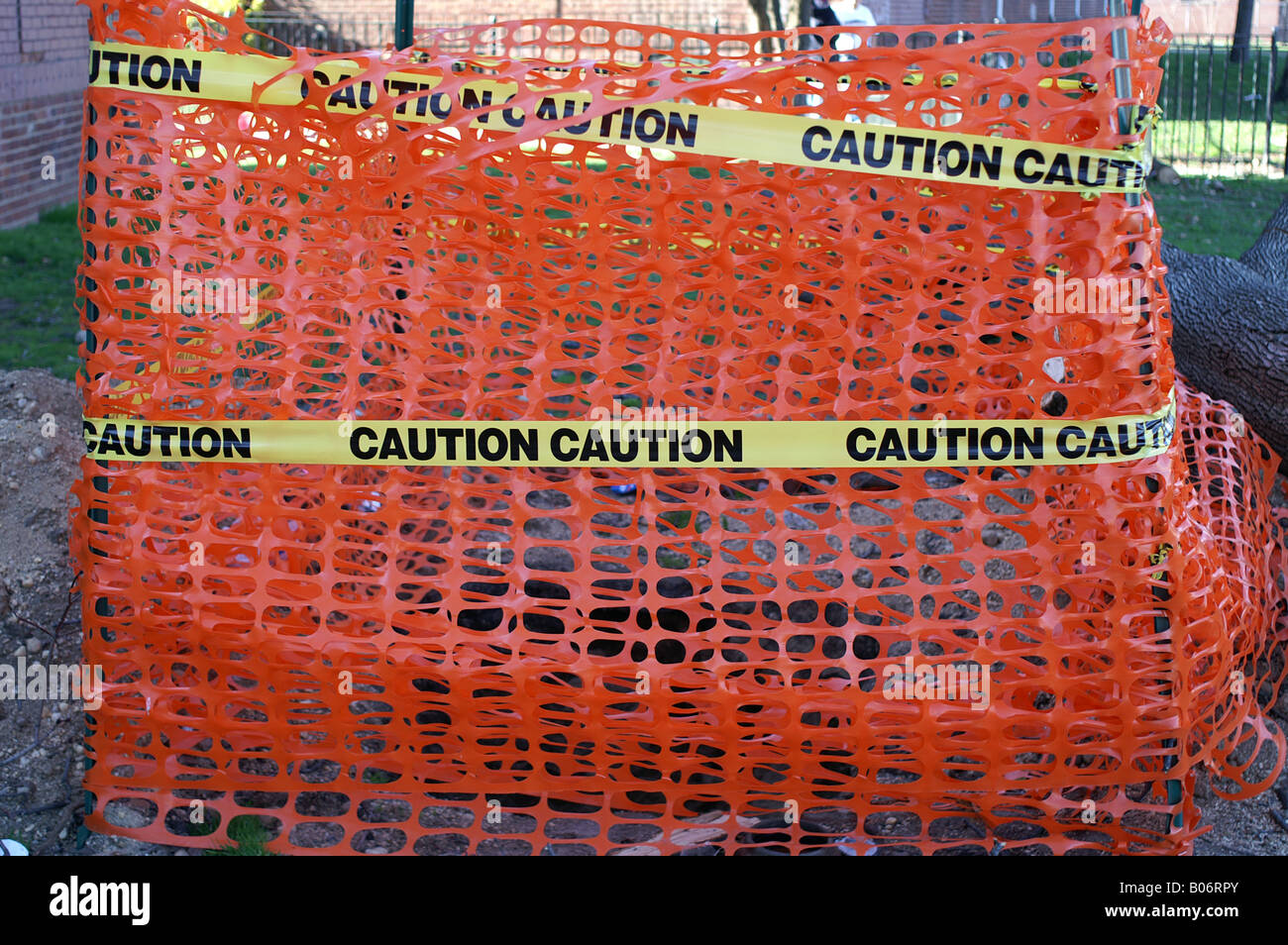 caution tape orange fence around hole construction Stock Photo Alamy