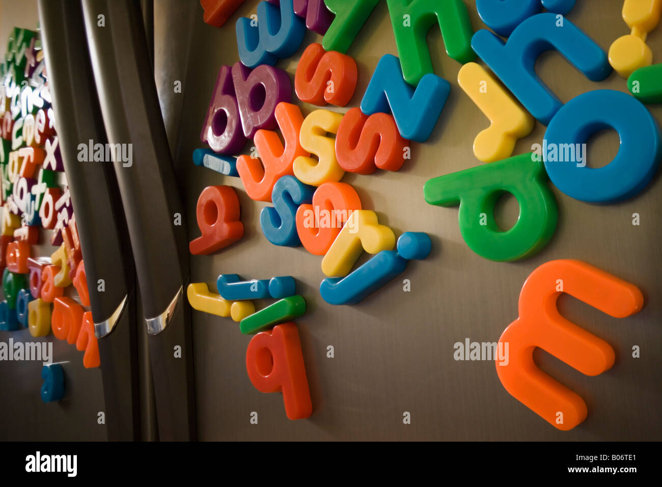 Alphabet fridge magnets on double doored stainless steel fridge Stock