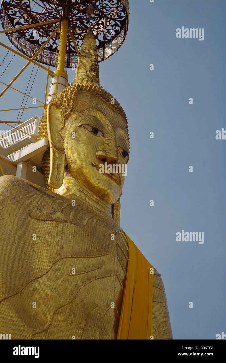 The GIANT STANDING BUDDHA 32 meters known as LUANG PHO TO at the Buddhist Temple of WAT INTHARAVIHAN BANGKOK THAILAND Stock Photo