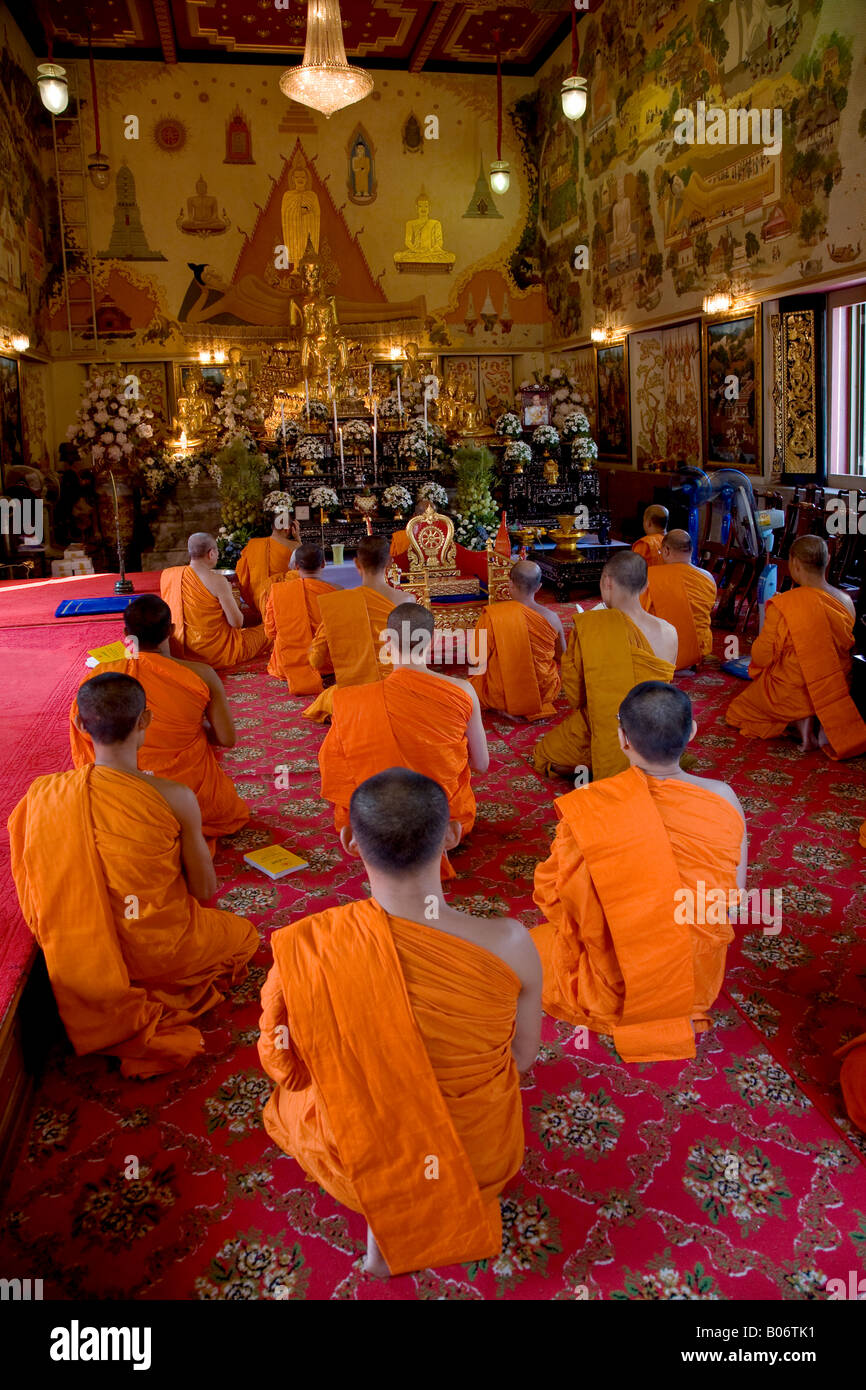 THAI HINAYANA MONKS worship at the Buddhist Temple of WAT INTHARAVIHAN