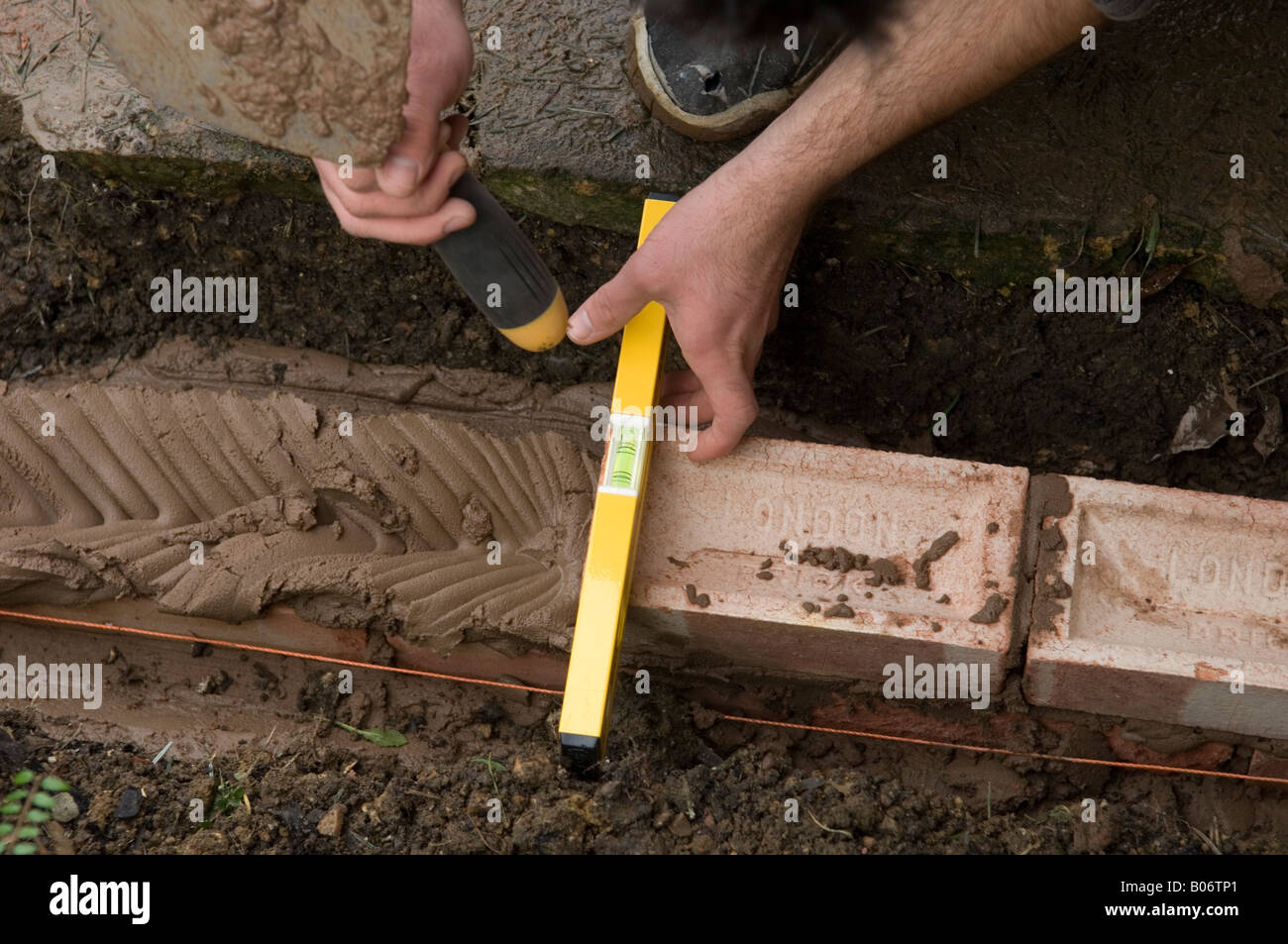 DIY How to build a brick wall Stock Photo Alamy