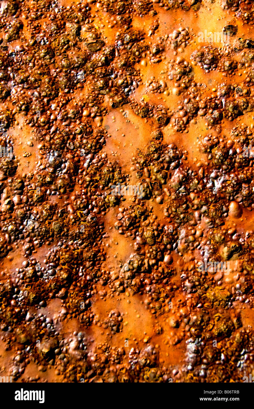 Rust and corrosion showing through old paintwork. Stock Photo