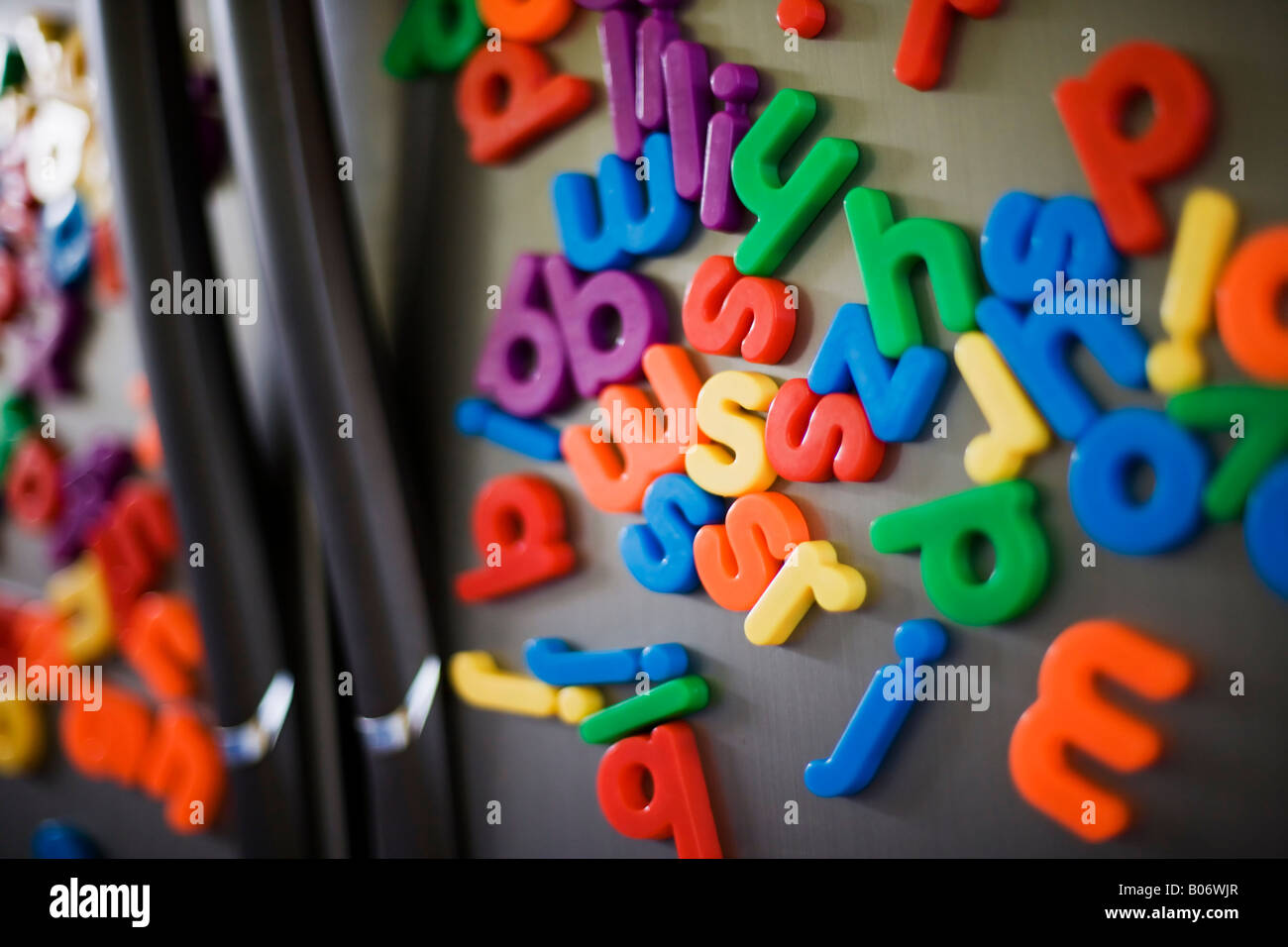 Alphabet fridge on double doored stainless steel fridge Stock