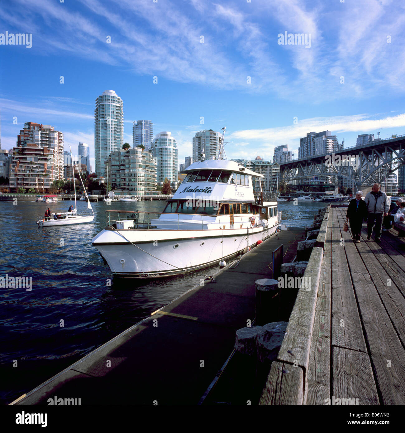 Cruise Boat docked at Granville Island in False Creek and City of
