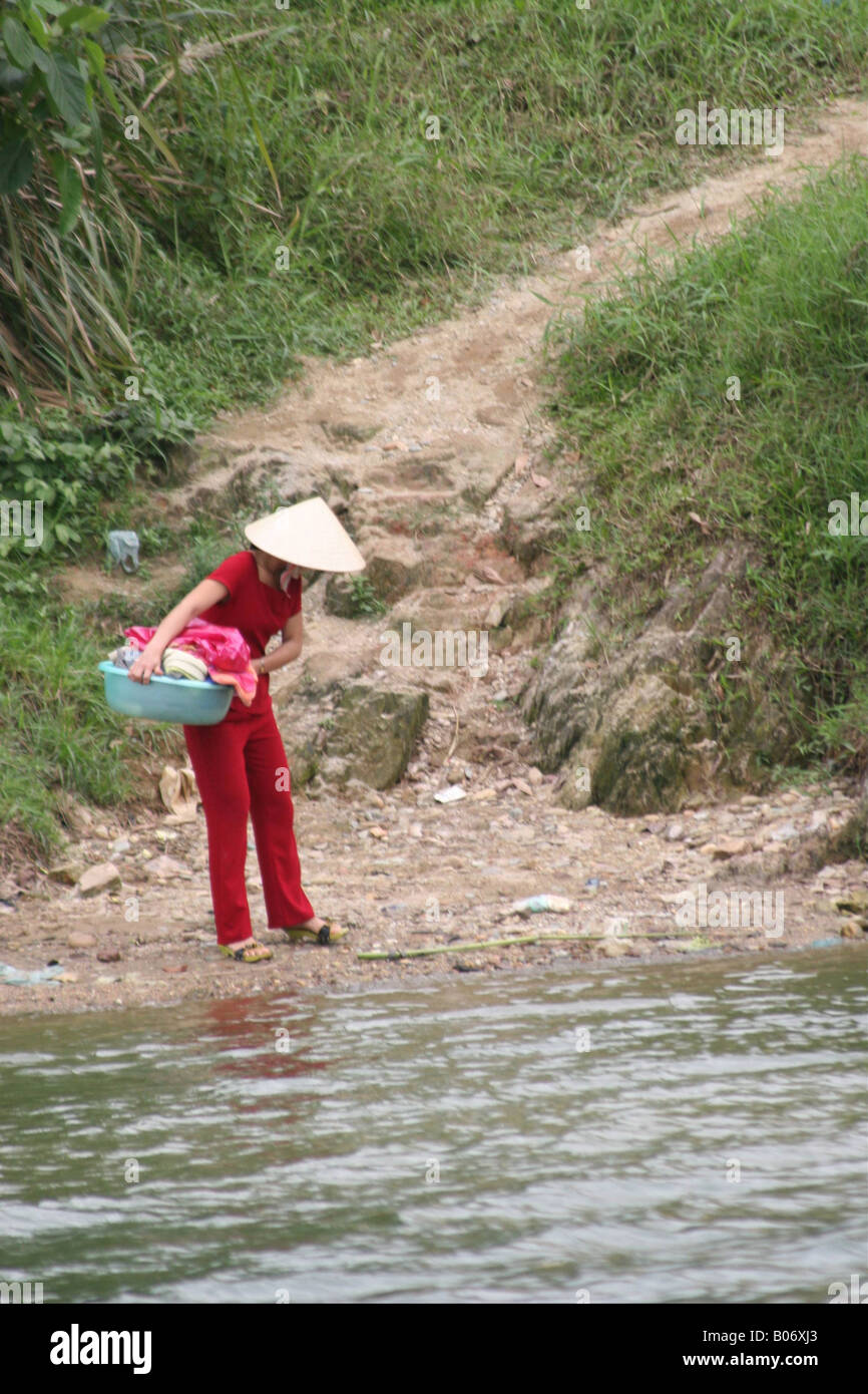Vietnamese woman doing laundry Stock Photo