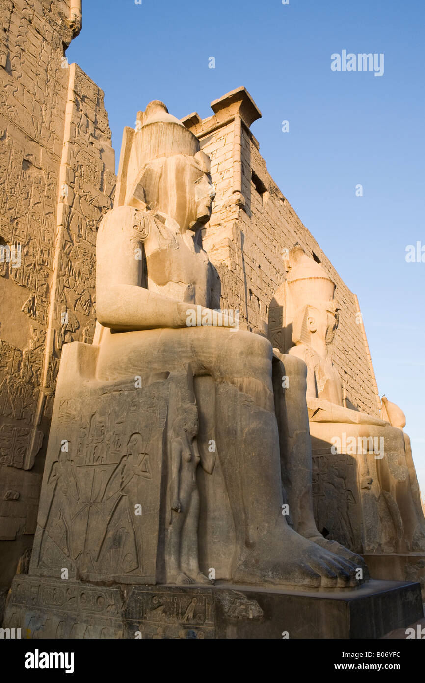 The colossal statues of Ramesses II at the pylon entrance to entrance ...