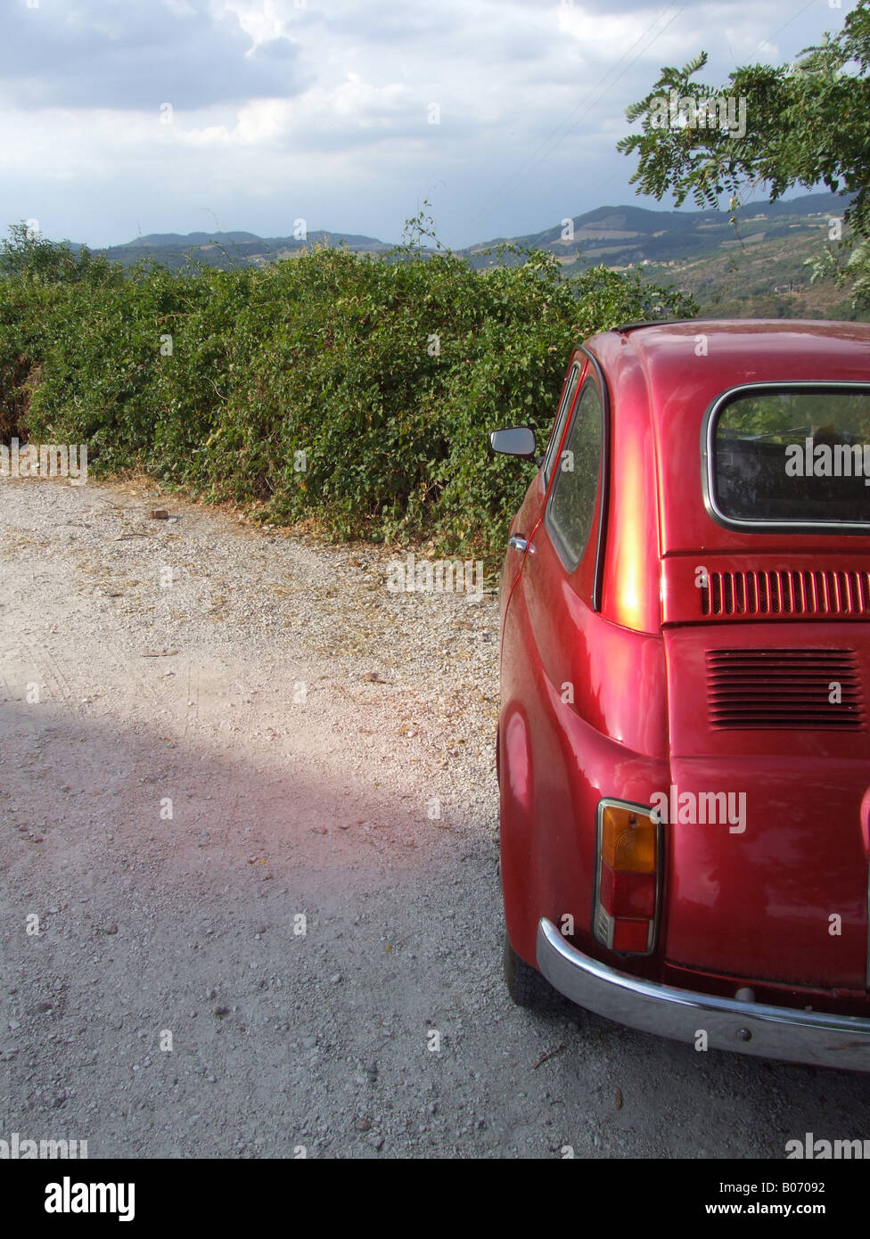 one old red fiat 500 car parked in countryside Stock Photo - Alamy
