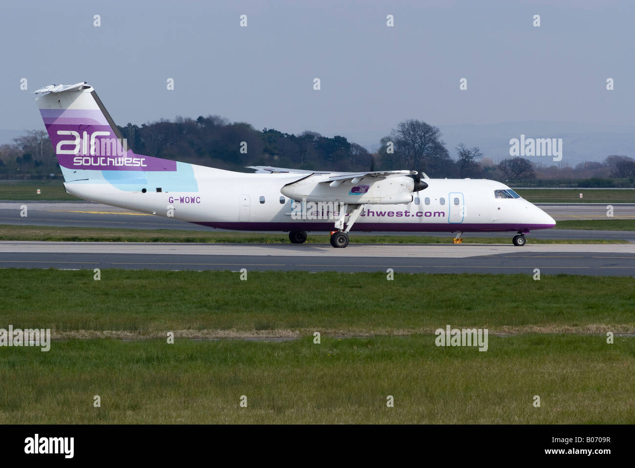 De Havilland Dash 8 [DHC-8-311Q] of Air Southwest taxiing for Take-off at Manchester Ringway Airport England United Kingdom Stock Photo