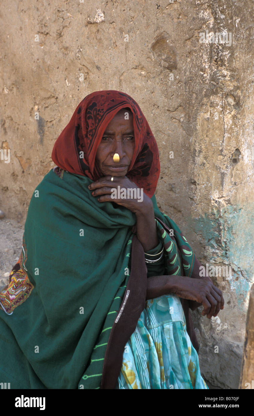 Tigray woman or Eritrean woman in shawl with nose ring depressed after  battle in her town over border with Ethiopia Stock Photo - Alamy