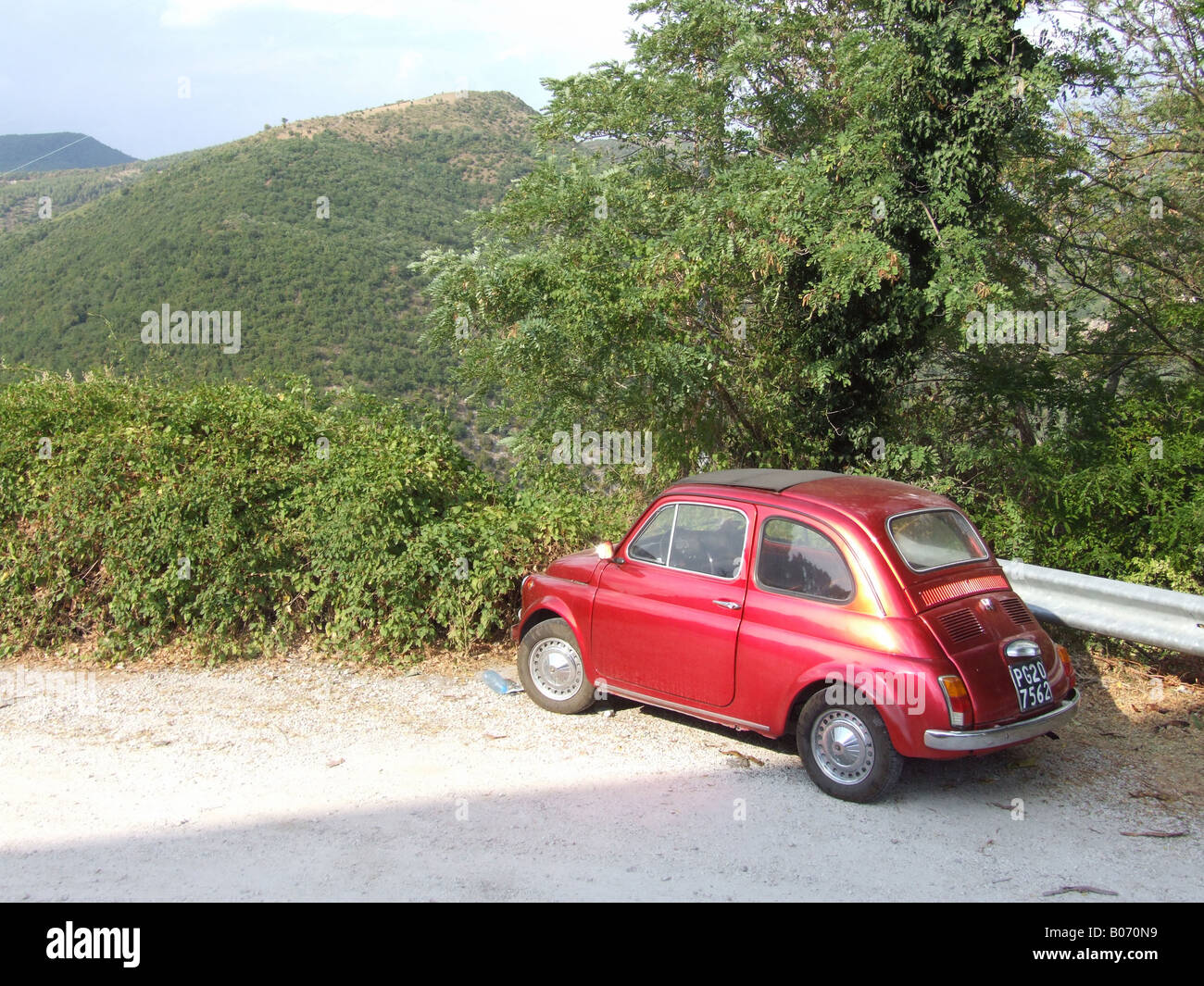 one old red fiat 500 car parked in countryside Stock Photo - Alamy