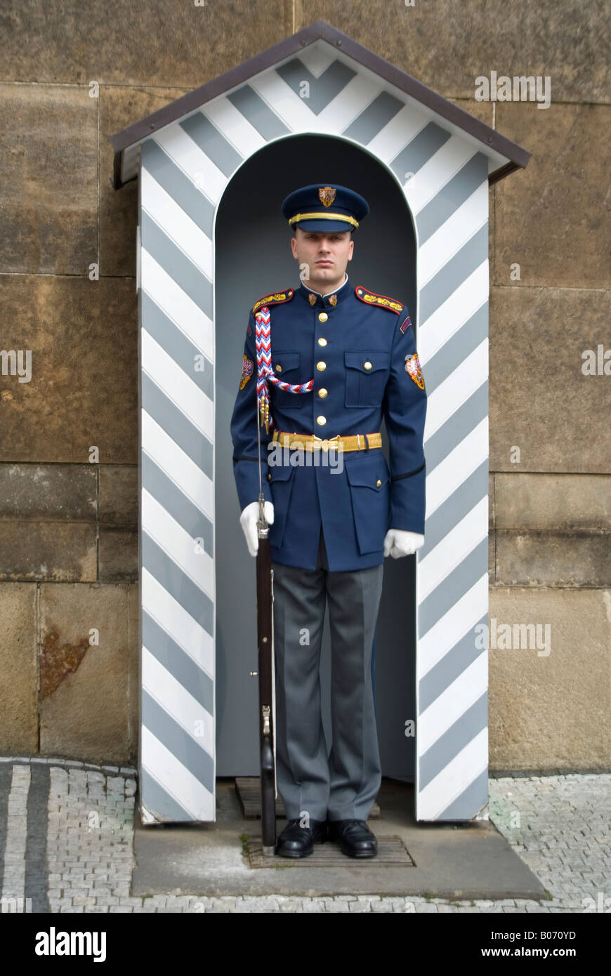 Vertical close up of a Castle Guards of the Czech Armed Forces on duty outside Prague Castle 'Prazsky Hrad' in the sunshine. Stock Photo